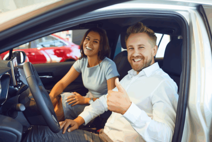 Couple purchasing a car. Learn how to save on auto loans